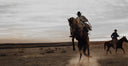 Cowboy Riding A Horse
